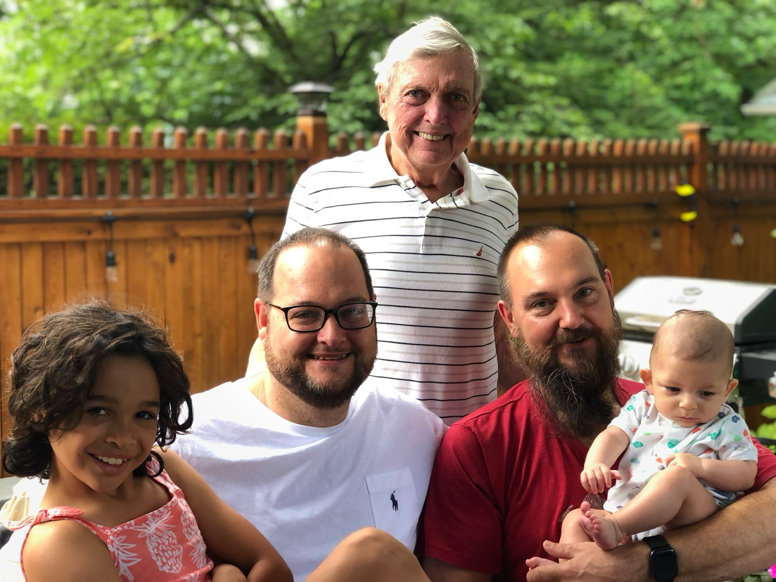 Dad, Jeff, and family smiling together outside on Father's Day 2019