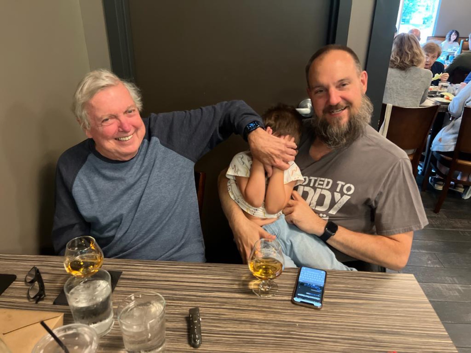 Dad, Jeff, and Khoren laughing together on Father's Day 2022